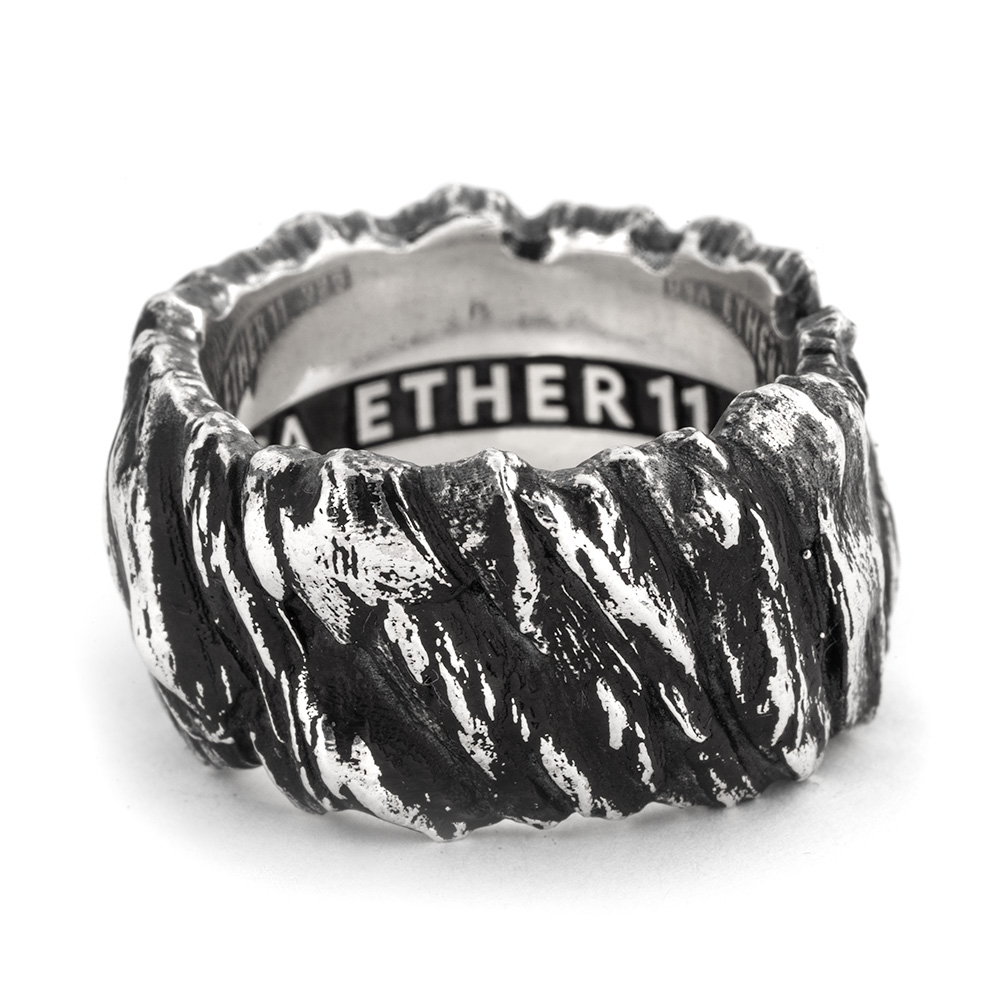 Studio view of the Stone Cliff Band showing the sheer carved silver walls that give the ring its name.