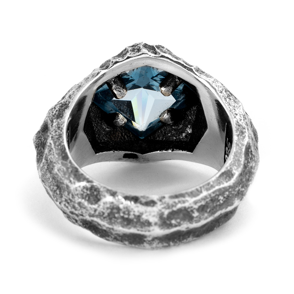 Rear view of the Formation Signet Ring showing the aquamarine held in four silver prongs behind the open setting.