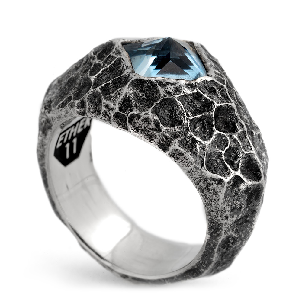The Formation Signet Ring in oxidized sterling silver with a cracked stone texture, set with a step-cut aquamarine, handmade in Los Angeles by Ether Eleven.