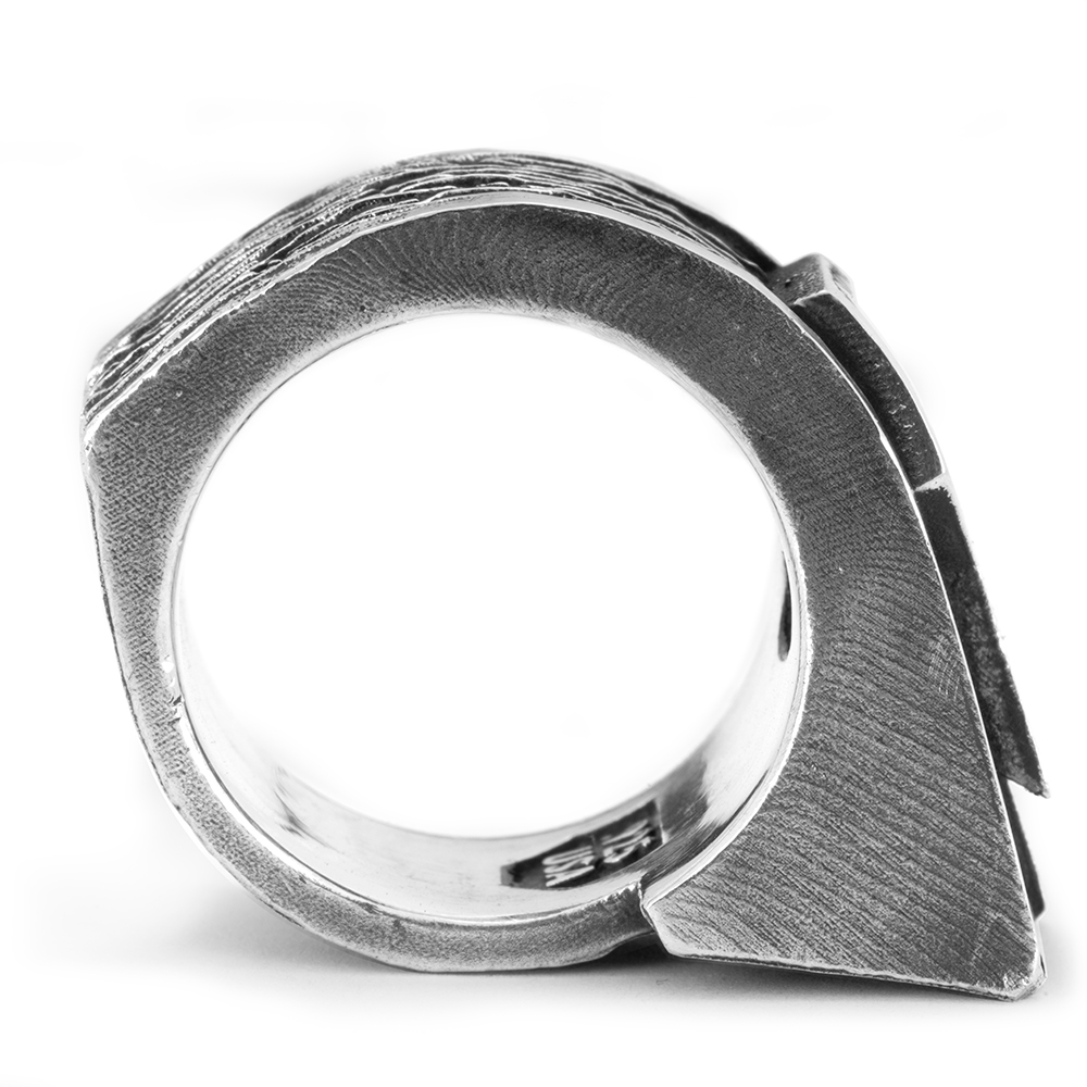 Front profile of the Gravity Ring showing the angular sterling silver band and wedge-shaped face.
