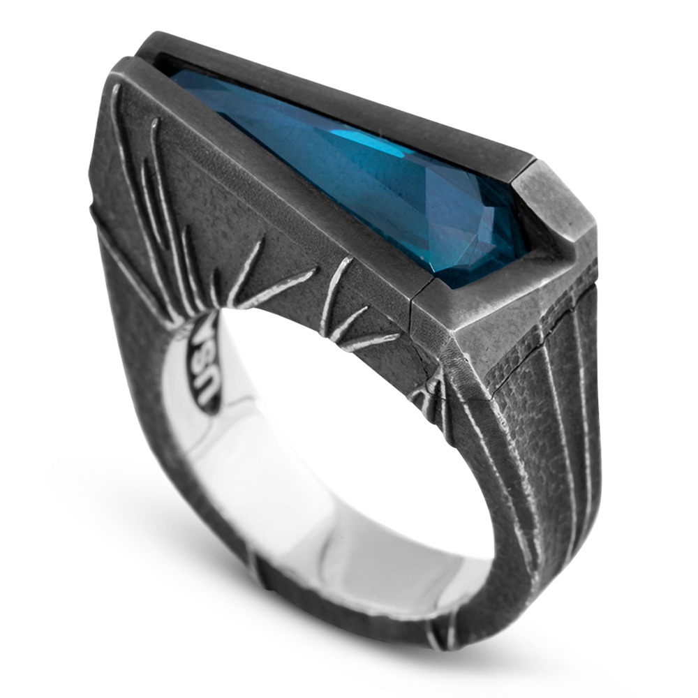 Momentum Ring — hero The Momentum Ring in oxidized sterling silver, crowned with a wedge-cut nano crystal Paraiba tourmaline, from the Ether Eleven M31 collection.