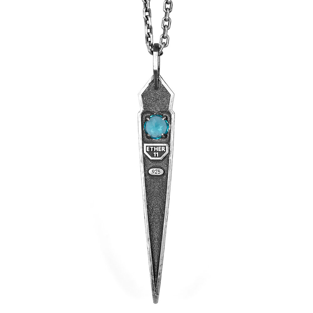 Reverse of the Needle Necklace 3i showing the Ether 11 maker's mark and .925 stamp below the faceted blue stone.