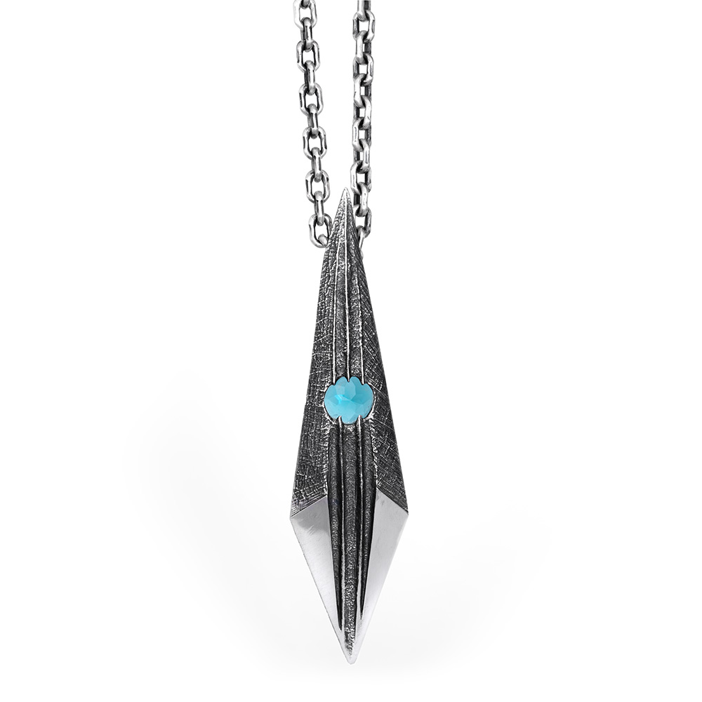 Shard Pendant — hero The Shard Pendant in oxidized sterling silver, a faceted blade form set with a Paraiba tourmaline, on a sterling silver chain by Ether Eleven.
